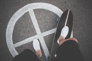 Free- Man on Skateboard with Sign on Ground