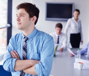 Group of happy young business people in a meeting at office