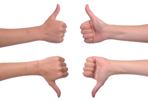 front and back woman hands showing thumbs up and down (isolated on white background)