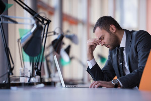 happy young business man portrait in bright modern office indoor